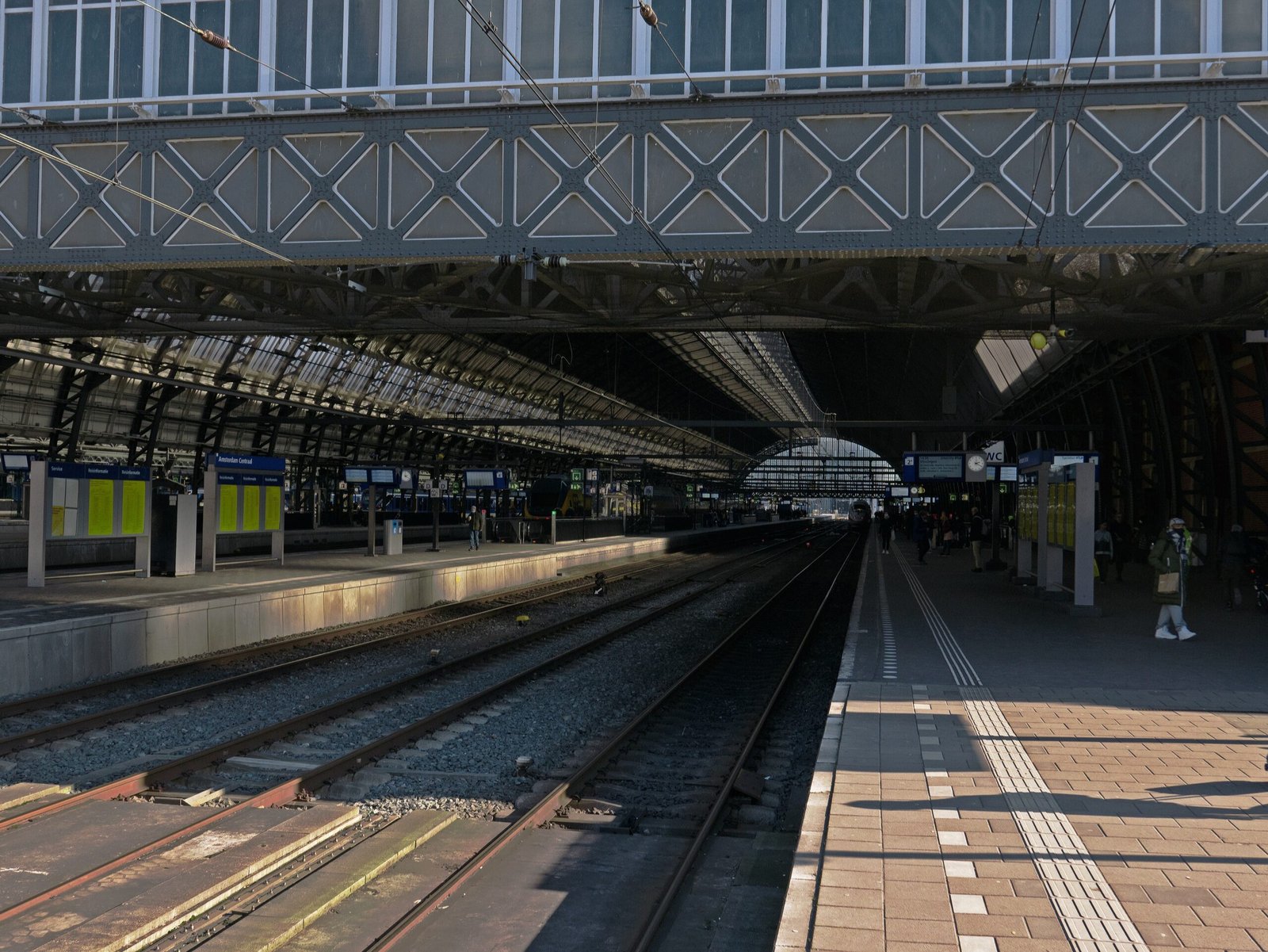 a train station with a train on the tracks